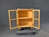 a small wooden cabinet with two doors open
