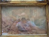 a picture of a woman sitting in a chair holding a picture