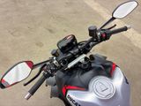 a close up of a motorcycle ' s handlebars and mirrors