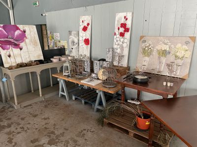 a room with a lot of art on the table