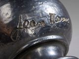 a silver vase with the word japan on it