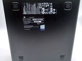 the back of a black laptop with a blue and white sticker on it