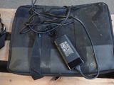 a black bag with a charger attached to it