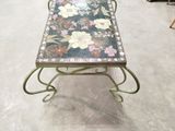 a table with a floral design on it in a room