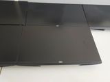 a laptop computer sitting on top of a white desk