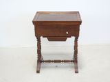 a small wooden table with a drawer on top of it