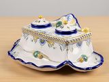 a blue and white dish with a lid on a wooden table
