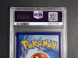 a close up of a pokemon card with a red ball on it