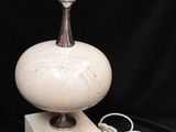 a lamp that is sitting on top of a block