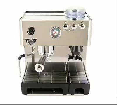 the coffee machine is sitting on the table ready to be used