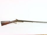 two guns are on a white surface next to each other
