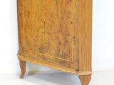 an old wooden cabinet with a clock on top of it