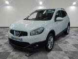 the white nissan qxv is parked on a checkered floor