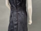 an image of a mannequin wearing a black dress on a mannequin