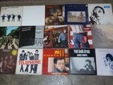a lot of records on the floor of this room
