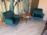 two chairs and a table in the corner of a room