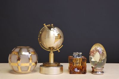 three different types of glass vases on a table