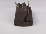 a close up of a brown bag on a white surface