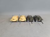 four different types of tanks are lined up on a table