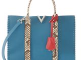 a blue and brown handbag with a red handle