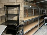 a bike that is parked next to a shelf in a garage