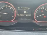 a close up of a car dashboard with gauges and speedometers
