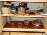 a shelf that has a pot and glasses on it