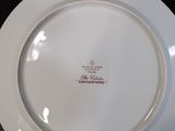 a white plate with a red and white design on it
