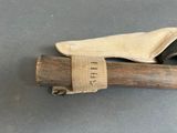 a wooden stick with a cloth bag on top of it
