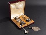 a box with silverware in it on a black surface