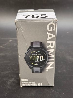 a box with a watch inside of it on a table
