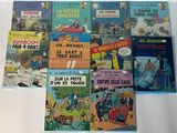 a lot of comic books on the table