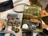 a table with many items on it including a purse and a purse