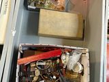 two boxes with various items in them on a table