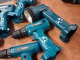 a lot of power tools that are sitting on a table
