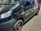 a black van with a pink design on the side of it