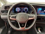 the interior of a car with a steering wheel and dashboard controls