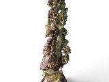 a statue of a tree that is on a stand