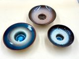 three bowls that are sitting on a table