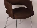 a brown chair with chrome legs on a white background