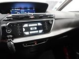the dashboard of a car with a digital display in the center