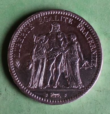 an image of a coin with a picture of a man and a woman on it