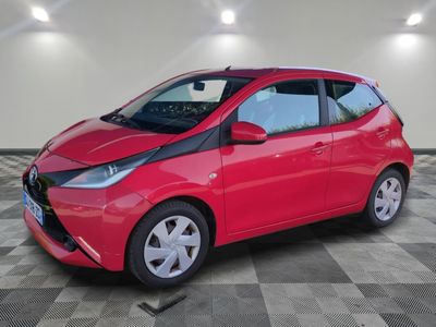 a picture of a red car parked in a garage