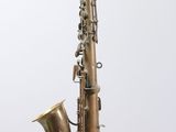 a close up of a brass saxophone on a white background