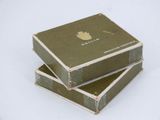 three boxes stacked on top of each other on a white surface