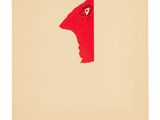 a red piece of paper with a face in the middle of it