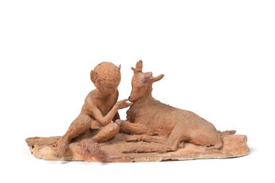 figurine of two children playing with a cow on a rug