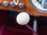 a close up of a ball on a stick in a car