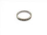 a close up of a ring on a white surface
