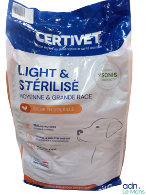 a bag of light and sterilised dog food on a white background